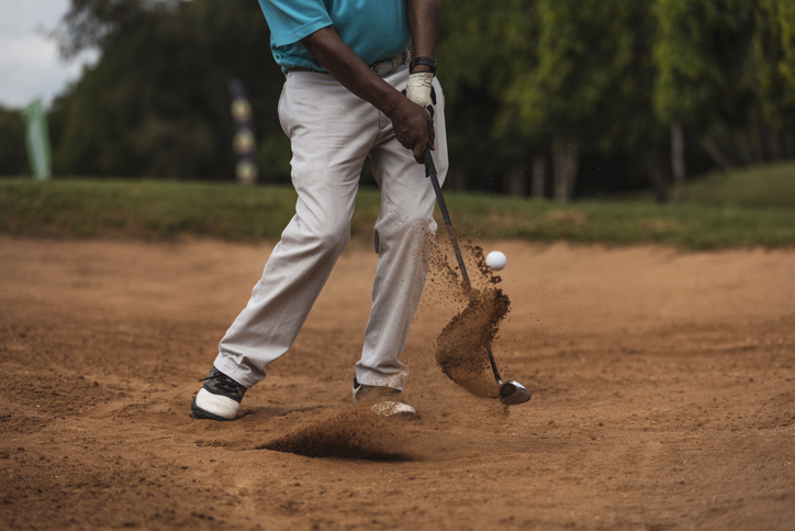 Freeze frame of golfer in action